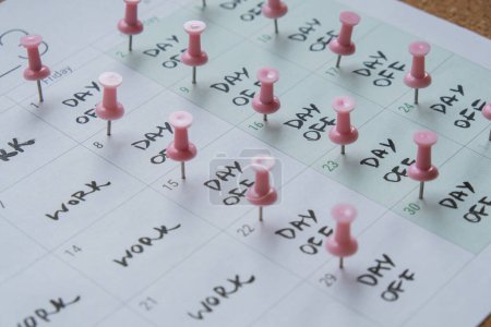 Photo for 4 day work week printed calendar with pink pins on three days off in week weekend days four day working week concept. Modern approach doing business short workweek. Effectiveness of employees - Royalty Free Image
