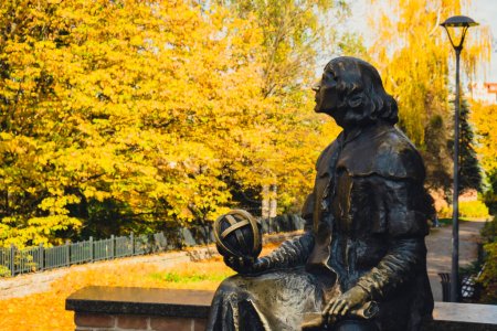 Photo for Olsztyn Poland - October 2022 Planet in hand of Nicolaus Copernicus statue near his famous castle. Nicolaus Copernicus statue on the Old Town in Olsztyn. Famous tourist attraction travel destination - Royalty Free Image