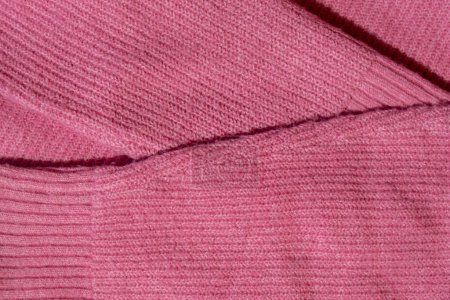 Photo for No Lints on pink sweater. Acrylic or wool sweater. After cleaning and collected fluff lint. Closeup sweater. Old used sweater without lint pilling. Restoration of old damaged clothes care. Repairing - Royalty Free Image