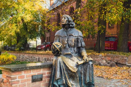 Photo for Olsztyn Poland - October 2022 Planet in hand of Nicolaus Copernicus statue near his famous castle. Nicolaus Copernicus statue on the Old Town in Olsztyn. Famous tourist attraction travel destination - Royalty Free Image