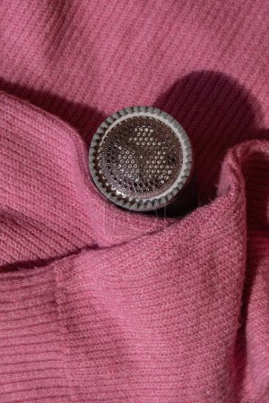 Photo for Anti-pilling razor. Device for shaving clothes. Anti-Plush fabric Shaver. Electric portable sweater pill defuzzer Lint remover from pink acrylic or wool sweater. Electric device fabric shaver after - Royalty Free Image