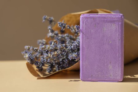 Handmade aromatic spa lavender soap. Natural additives and extracts. Bar of lavender soap with dried flowers. Beauty treatment product herbal ecological organic cosmetics. Copy space