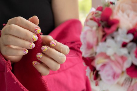 Woman manicured hands, stylish summer colorful nails. Closeup of manicured nails of female hand. Summer style of nail design concept. Beauty treatment.
