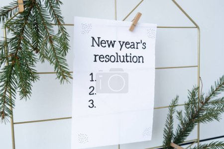 Photo for NEW YEARS RESOLUTION paper note on Dream board promises and aims. Preparation for new year new life new me. Visualizing wish list for 2025. Dreams plan action for coming year. Inspirational self - Royalty Free Image