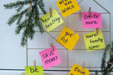Photo for Vision board with new year resolutions aims goals on sticky notes. Preparation for New Year. Concept of planning and setting goals for personal development - Royalty Free Image