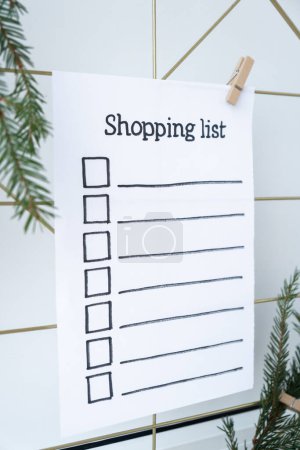 Photo for Preparation for winter holidays. SHOPPING LIST text on paper note. Celebration gifts and presents preparing Natural zero waste homemade Christmas decor. Happy new year concept. - Royalty Free Image