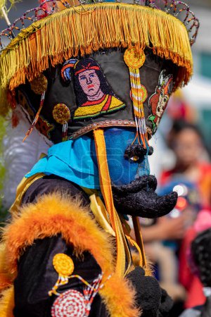 Photo for A person with a colorful chinelo costume, dancing in a carnival in Mexico - Royalty Free Image