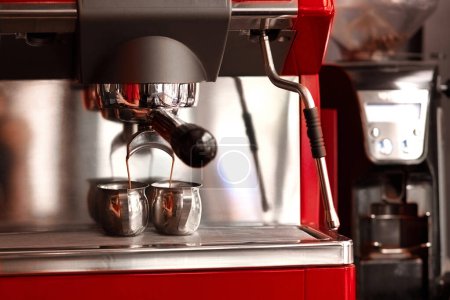 Preparing 2 servings of espresso using a professional coffee machine