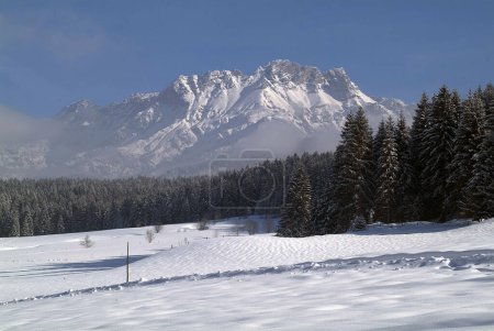 Photo for Austria, snow covered landscape in ski resort Pillersee Valley in North Tyrol, view to Leoganger Steinberge mountain - Royalty Free Image