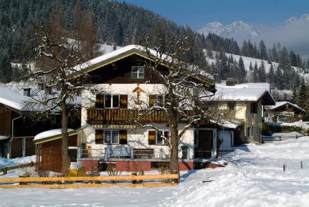 Photo for Austria, Tyrol,  house of traditional wooden construction in a wintry setting - Royalty Free Image