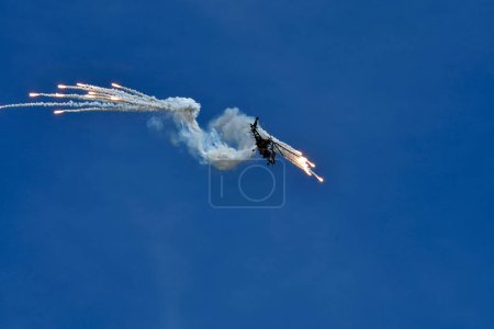Photo for Zeltweg, Austria - September 03, 2022: Public airshow in Styria named Airpower 22, demonstration with an Agusta A109 helicopter with defensive capabilities - Royalty Free Image