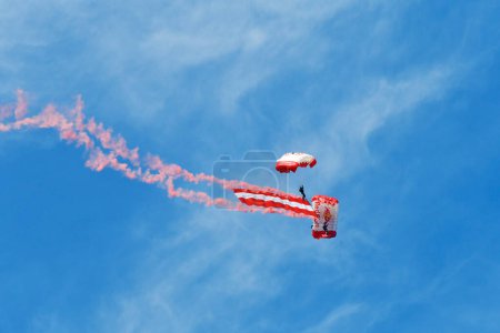 Photo for Zeltweg, Austria - September 03, 2022: Public airshow in Styria named Airpower 22, two parachutists with the Austrian flag at the air show - Royalty Free Image