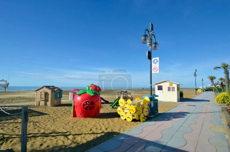 Photo for Jesolo, Italy - April 17, 2024: Beginning of the season with children playground on the Lido of Jesolo with a wide sandy beach on Adriatic - Royalty Free Image