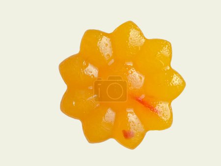 Photo for Close up shot of flower shaped vegan orange saffron agar jelly - Royalty Free Image