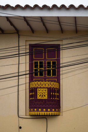 Photo for Facade of a Beige Residential Building with a Yellow and Purple Door - Royalty Free Image