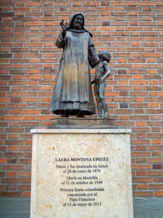 Photo for Jerico, Antioquia  Colombia - April 5 2022: Bronze Statue of Saint Laura Montoya Upegui by the Cathedral of Jerico with Historical Text Below - Royalty Free Image