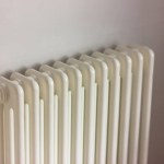 white heating radiator in room. the concept of home heating, heat preservation and savings.