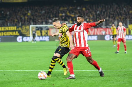 Photo for 8 MIJAT GA?INOVI? of AEK FC competing with 23 RODINEI of Olympiacos FC during the Greek Super League, Matchday 26, match between AEK FC and Olympiacos FC at OPAP Arena on March 12, 2023, in Athens, Greece. - Credit: Stefanos Kyriazis/LiveMedi - Royalty Free Image