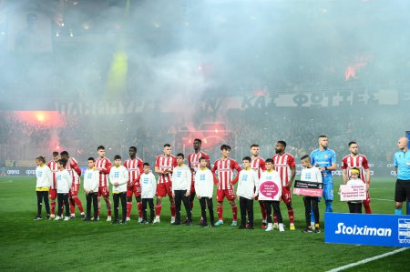 Photo for Olympiacos FC during the Greek Super League, Matchday 26, match between AEK FC and Olympiacos FC at OPAP Arena on March 12, 2023, in Athens, Greece. - Credit: Stefanos Kyriazis/LiveMedi - Royalty Free Image