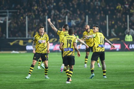 Photo for 10 STEVEN ZUBER of AEK FC celebrating with his teammates a goal during the Greek Super League, Matchday 26, match between AEK FC and Olympiacos FC at OPAP Arena on March 12, 2023, in Athens, Greece. - Credit: Stefanos Kyriazis/LiveMedi - Royalty Free Image