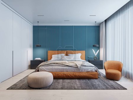 Contemporary bedroom with a blue and white wall and an orange bed and a chair with a beige ottoman. 3d rendering.