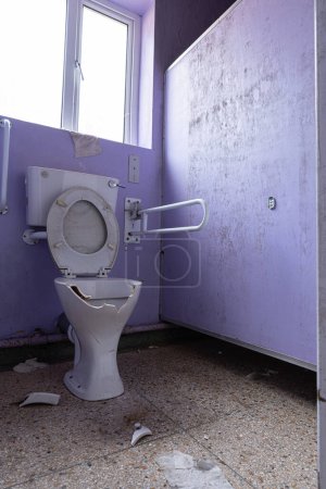 Photo for Vandalised geriatric toilet in abandoned Hospital derelict. - Royalty Free Image