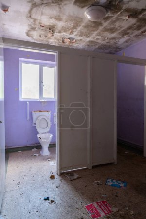 Photo for Vandalised geriatric toilet with supports in abandoned Hospital derelict. - Royalty Free Image