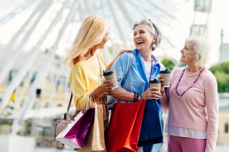 Photo for Beautiful happy senior women meeting outdoors and shopping in the city centre - Pretty and joyful old female adult people bonding and having fun outdoors - Royalty Free Image