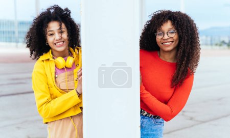 Photo for Young happy women having fun outdoor , laughing and sharing good mood. Teenagers friends spending time outdoor in Barcelona - Royalty Free Image