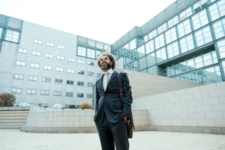 Photo for Young entrepreneur business man walking outside his office after a busy day of successful work - Royalty Free Image