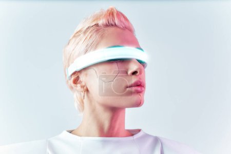 Photo for Representation of a bionic super human with advanced technology parts as vr visors and gadgets playing in a mixed reality training room. Futuristic cyberpunk evolution of human mankind and AI - Royalty Free Image