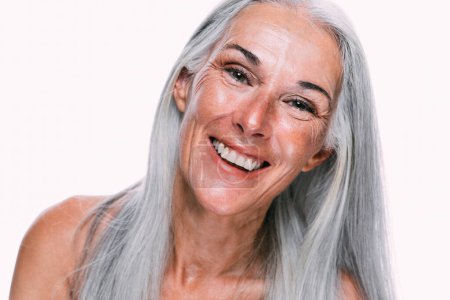 Photo for Image of a beautiful senior woman posing on a beauty photo session. Middle aged woman on a colored background. Concept about body positivity, self esteem and body acceptance - Royalty Free Image
