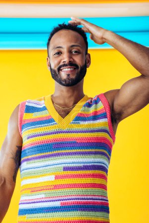 Photo for Image of an handsome young man posing on colored backgrounds wearing colorful trendy clothes. Concept about carefree, fashion and lifestyle - Royalty Free Image