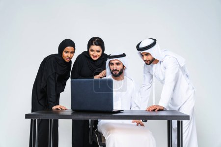 Photo for Group of arab business people working together in the office - Corporate middle-eastern business team brainstorming on a business plan in Dubia, concepts about teamwork and remote working - Royalty Free Image