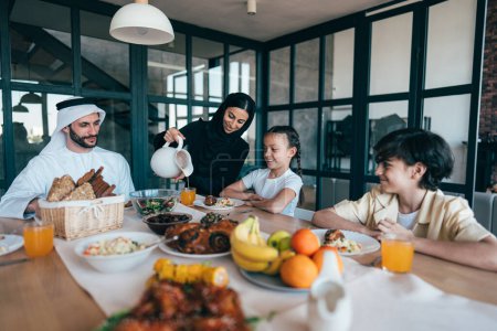 Photo for Traditional arabian family from Dubai spending time together at home. Concept about, emirati culture, parenthood, adoption and  family lifestyle - Royalty Free Image