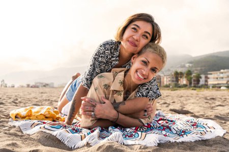 Photo for Beautiful multiethnic lesbian couple of lovers dating outdoors - LGBT people bonding and spending time together, concepts about LGBTQ community, diversity, love and lifestyle - Royalty Free Image