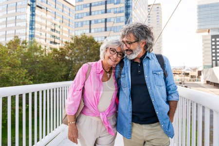 Photo for Beautiful happy senior couple bonding outdoors - Cheerful old people romantic dating in the city, concepts about elderly and lifestyle - Royalty Free Image