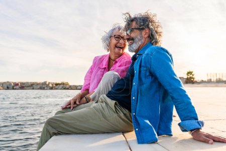 Photo for Beautiful happy senior couple bonding outdoors - Cheerful old people romantic dating in the city, concepts about elderly and lifestyle - Royalty Free Image