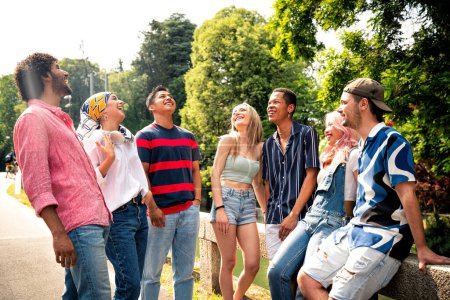 Photo for Group of multiethnic teenagers spending time outdoor and having fun. Concept about generation z, lifestyle and friendship - Royalty Free Image