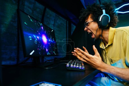 Photo for Multiethnic group of young friends playing videogames - Team of professional esport gamers playing in competitive video games on a cyber Games Tournament - Royalty Free Image