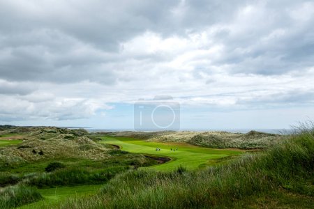 An hilly golf course facing the sea in Scotland