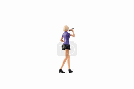 Photo for Miniature people female singer isolated on white background with clipping path - Royalty Free Image