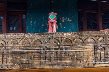 Photo for Panjim, Goa, India - January 2023: Carvings on the rustic surface of an old vintage Portuguese era house in Fontainhas in the city of Panaji. - Royalty Free Image
