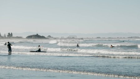Sports water activities in the evening on the Pacific coast. The coast in New Zealand. Seascape.