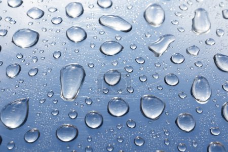 Water drops on steel background Poster 654139556
