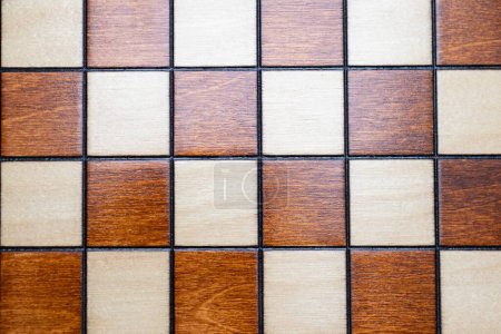 Photo for Checkerboard - chessboard detail - top view squares, wooden background - Royalty Free Image