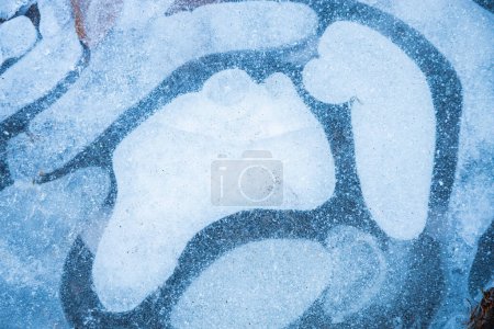 Photo for Frozen bubbles in puddle - top view winter background - Royalty Free Image