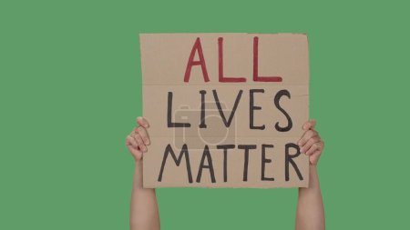 Photo for Hands of men raising up cardboard poster ALL LIVES MATTER. Stop Racism concept, No Racism. Rallies against racism and discrimination. Peaceful life of blacks matters. Isolated green screen chroma key. - Royalty Free Image