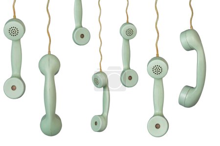 Photo for Many old telephone handsets from rotary landlines hanging from cords on white background. Plastic grey removed receiver from retro phone with cable. Concept of communication, conversation, connection - Royalty Free Image