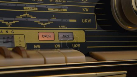 Photo for Front panel of vintage radio with radio wave frequency, buttons and knob. Dashboard of an analog old radio close up. Antique radio speaker for listening to media and music. Retro background, nostalgia - Royalty Free Image